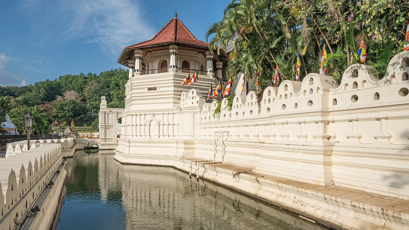 Temple of the Sacred Tooth Relic in Kandy beside the tranquil lake